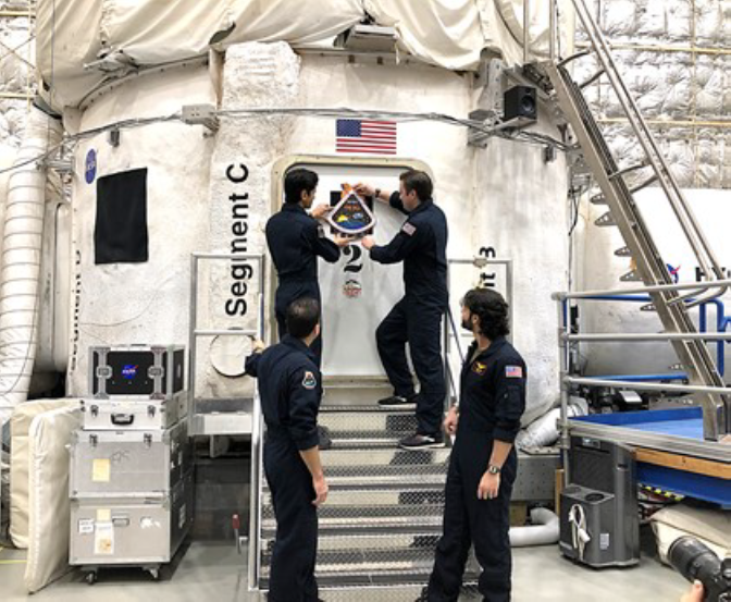 Image of astronauts going into quarantine - the need for AI for human health support
